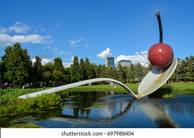 AUGUST 1 - MINNEAPOLIS, MINNESOTA: Famous Spoon and Cherry sculpture in the newly renovated Minneapolis Sculpture Garden at the Walker Art Center on a sunny summer day.