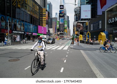 August 16, 2020 New Yorker Biking In Front Of Times Square With Mask After The Lockdown, New York City, USA