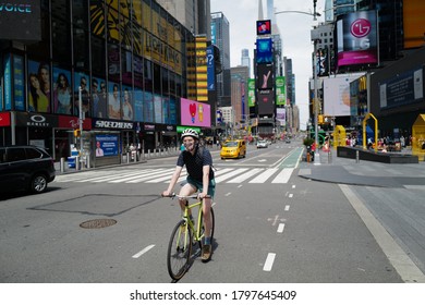 August 16, 2020 New Yorker Biking In Front Of Times Square With Mask After The Lockdown, New York City, USA