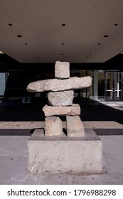 August 16,2020 Vancouver British Columbia Canada An Inuksuk Sculpture In Front Of Century Plaza Hotel Entranceway
