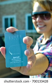 AUGUST 18 2016 - DULUTH, MINNESOTA: An Adult Female Holds Up A Silver Elite Status Marriott Hotel Key Card, In Selective Focus. Only The Card Is In Focus.