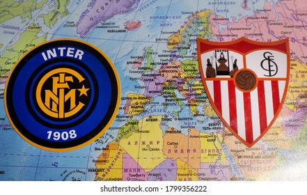 August 20, 2020 Cologne, Germany. The Emblems Of The 2019/2020 Europa League Finalists Sevilla FC And Inter Milan Against The Background Of The Europe Map.