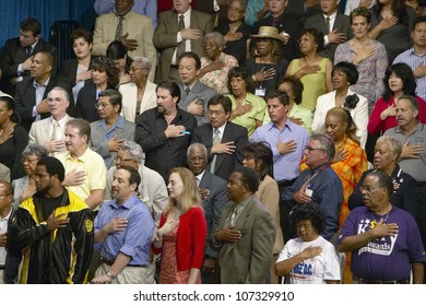 AUGUST 2004 - Multi-cultural crowd reciting Pledge of Allegiance at Kerry Campaign rally, CSU- Dominguez Hills, Los  Angeles, CA