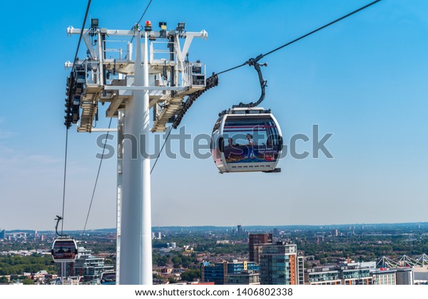 AUGUST 2018: Emirates Air Line cable cars on thames\
river in London, UK.