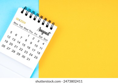 August 2024, Monthly desk calendar for 2024 year on yellow and blue color background.