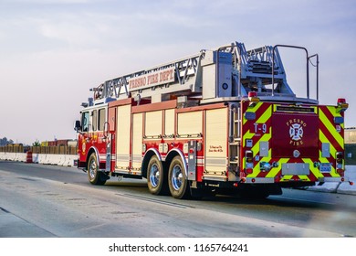 August 25, 2018 Fresno / CA / USA - Fire Engine Driving On The Freeway