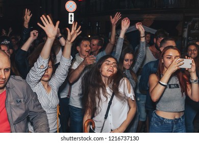 August 25, 2018 , Minsk,Belarus Street walks A group of people dancing in the street of the evening city - Shutterstock ID 1216737130