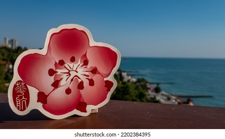 August 26, Sochi, Russia. The Emblem Of The Chinese Airline China Airlines On The Background Of The Embankment And The Seashore In The Resort Town.