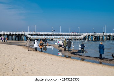 August 30, 2020, Gdask, Poland, View Of The Sopot Embankment On The Baltic Sea. People Feed The Seagull Birds