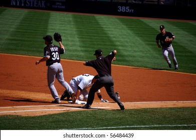 AUGUST 30 - BRONX, NY: Alex Rodriguez of the Yankees is picked off of first base in a game against the Chicago White Sox on August 30, 2009 in the Bronx, NY.