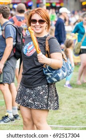 AUGUST 31 2016 - FALCON HEIGHTS, MINNESOTA: An Adult Woman Eats A Corn Dog At The Minnesota State Fair.