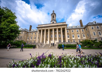 August 31, 2017: Students and adults walk in front of the Old Main building, on the campus of Penn State University, in State College, Pennsylvania. (5949)