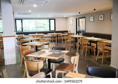 August 4 , 2019; Bangkok, Thailand:
wooden tables and chairs in cafeteria or food court - Shutterstock ID 1499363279