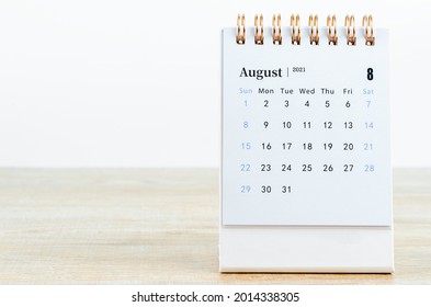 August Calendar 2021 on wooden table background. - Shutterstock ID 2014338305