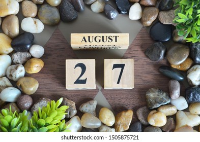 August month, Background with number cube, colorful stone, design in natural concept, Date 27.