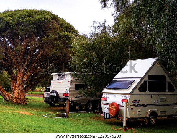 Augusta, Australia - September 5, 2018:\
Travel trailer and motorhome in the morning\
dawn.