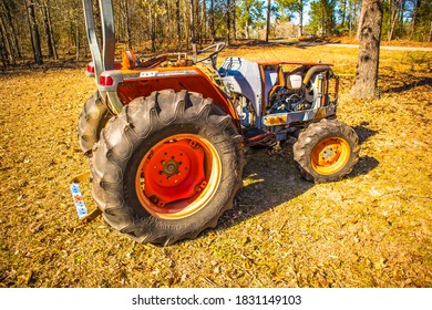 Augusta, Ga / USA - 02 29 20: Old Orange Farm Tractor Side View