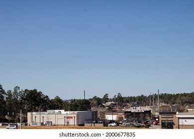 Augusta, Ga USA - 03 04 21: Overview Of Retail Strip Malls And City Traffic Clear Blue Sky - Walton Way Ext