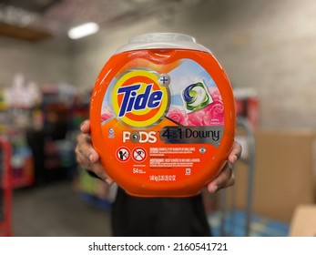 Augusta, Ga USA - 05 21 22: Person Holding Up Tide Laundry Detergent