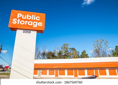 Augusta, Ga USA - 12 03 20: Orange And White Public Storage Street Sign And Building