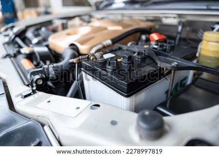 Auomobile repair, machine batteries car engine checking car battery cleaning for deliver customers in the car service. Batteries car. 
