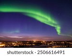 Aura Borealis over Rovaniemi City lights