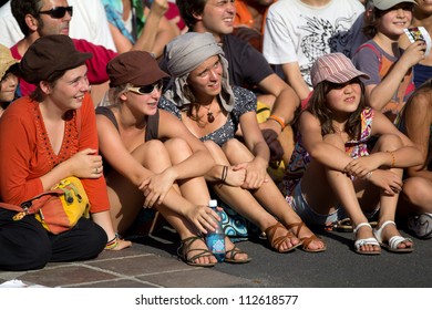 AURILLAC, FRANCE - AUGUST 22: spectators watching a show at the Aurillac International Street Theater Festival, on august 22, 2012, in Aurillac,France.