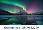 Aurora australis or Aurora borealis or Green northern lights sky above mountains. Night sky with polar lights. Night winter landscape with southern lights aurora against Real Natural black background.