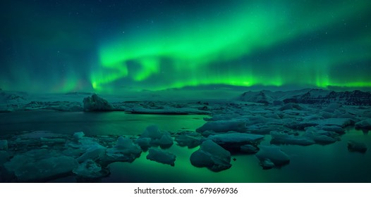 Aurora borealis above Jokulsarlon glacier lagoon, Iceland - Powered by Shutterstock