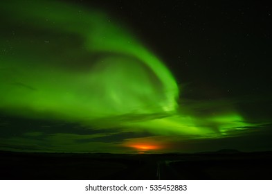 Aurora Borealis And Fire From Holuhraun Volcanic Eruption In Iceland.