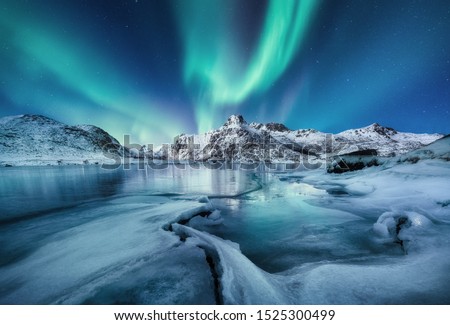 Aurora Borealis, Lofoten islands, Norway. Mountains and frozen ocean. Winter landscape in the night time. Northen light - image
