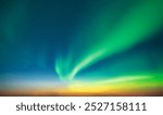 Aurora borealis in night winter sky. Sky with polar lights and stars. Waves of green Northern lights in Earth atmosphere