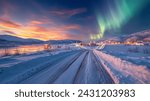 aurora borealis, northern lights over the village and mountains Abisko Kiruna