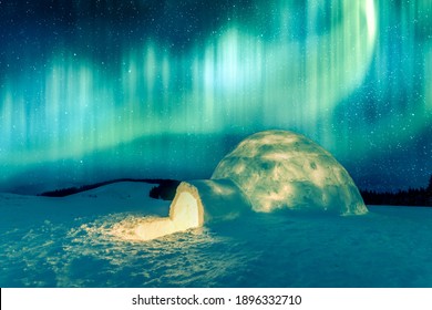 Aurora borealis. Northern lights in winter mountains. Wintry scene with glowing polar lights and snowy igloo. Landscape photography - Powered by Shutterstock