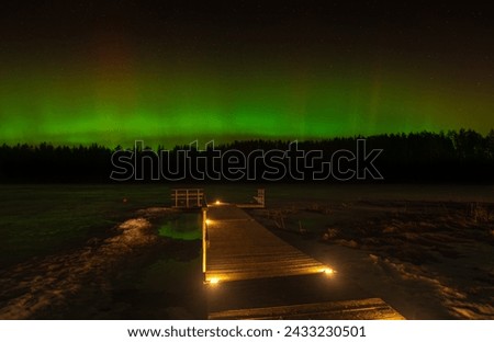 Aurora borealis at a swimming place on the shore of Lake Zagezers in Northern Latvia