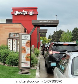 Aurora, CO, USA. June 27, 2019. Wendy's fast food restaurant drive thru line at 3110 Parker Road in Aurora, Colorado during a busy lunch hour. 