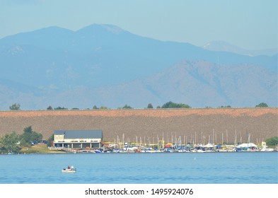 Aurora, CO, USA. Sep 2, 2019. Boat House And Boat Dock At Cherry Creek State Park Reservoir With The Mountains In The Background. 