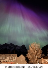 Aurora dancing over the mountains of Alberta.