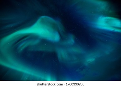Aurora dancing in the sky. Northern lights over Lofoten Islands, Norway. Top travel destination. Night photography - Shutterstock ID 1700330905