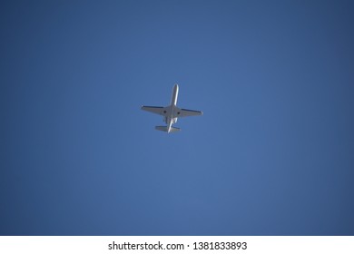 Aurora, Illinois - January 12, 2019: Small Jet Plane Flying Low Near Aurora’s Municipal Airport.