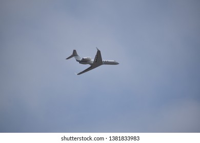 Aurora, Illinois - January 12, 2019: Small Jet Plane Flying Low Near Aurora’s Municipal Airport.