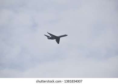 Aurora, Illinois - January 12, 2019: Small Jet Plane Flying Low Near Aurora’s Municipal Airport.