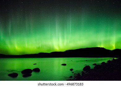The aurora look like heavenly flames over Lake Superior.