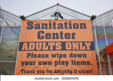 Aurora, OR, USA - Oct 17, 2020: The Sanitation Station Sign At The Harvest Festival In Fir Point Farms Reminds Visitors To Sanitize Play Items And Practice Good Hygiene During A Pandemic Fall Season.