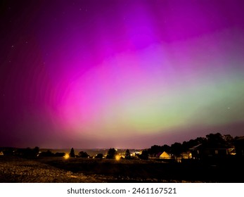 aurora over the city in the night in germany - Powered by Shutterstock