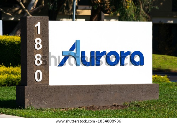 Aurora sign logo at headquarters. Aurora Innovation\
is an American self-driving technology company - Palo Alto,\
California, USA - 2020