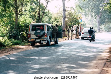 Auroville Tamil Nadu January 24, 2019 View Of Indian Police Officers Controlling Cars At The Road To Auroville In Southern India In The Afternoon