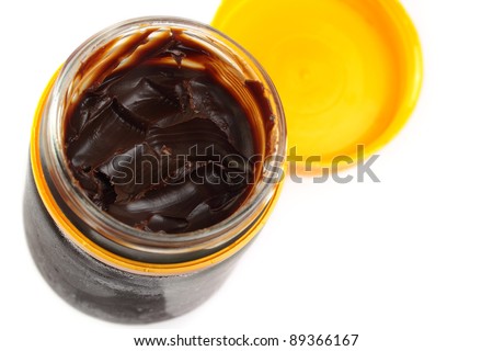 Aussie vegemite, complete with toast crumbs. Isolated on white.