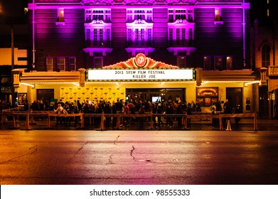 AUSTIN - MARCH 26: People gather for a red carpet gathering under a SXSW marquee at the Paramount Theater on March 26, 2012 in Austin, Texas.