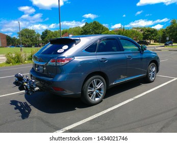 Austin, Texas - 25 June 2019: A 2015 Lexus RX 450h Hybrid Suv With A Bike Rack Connected To The Trailer Hitch